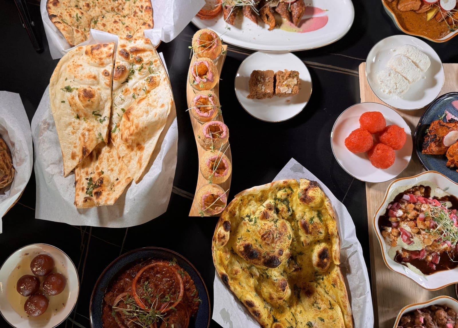 Feast spread photographed at DesINorth Milton — Indian & Hakka dishes in Milton, Ontario