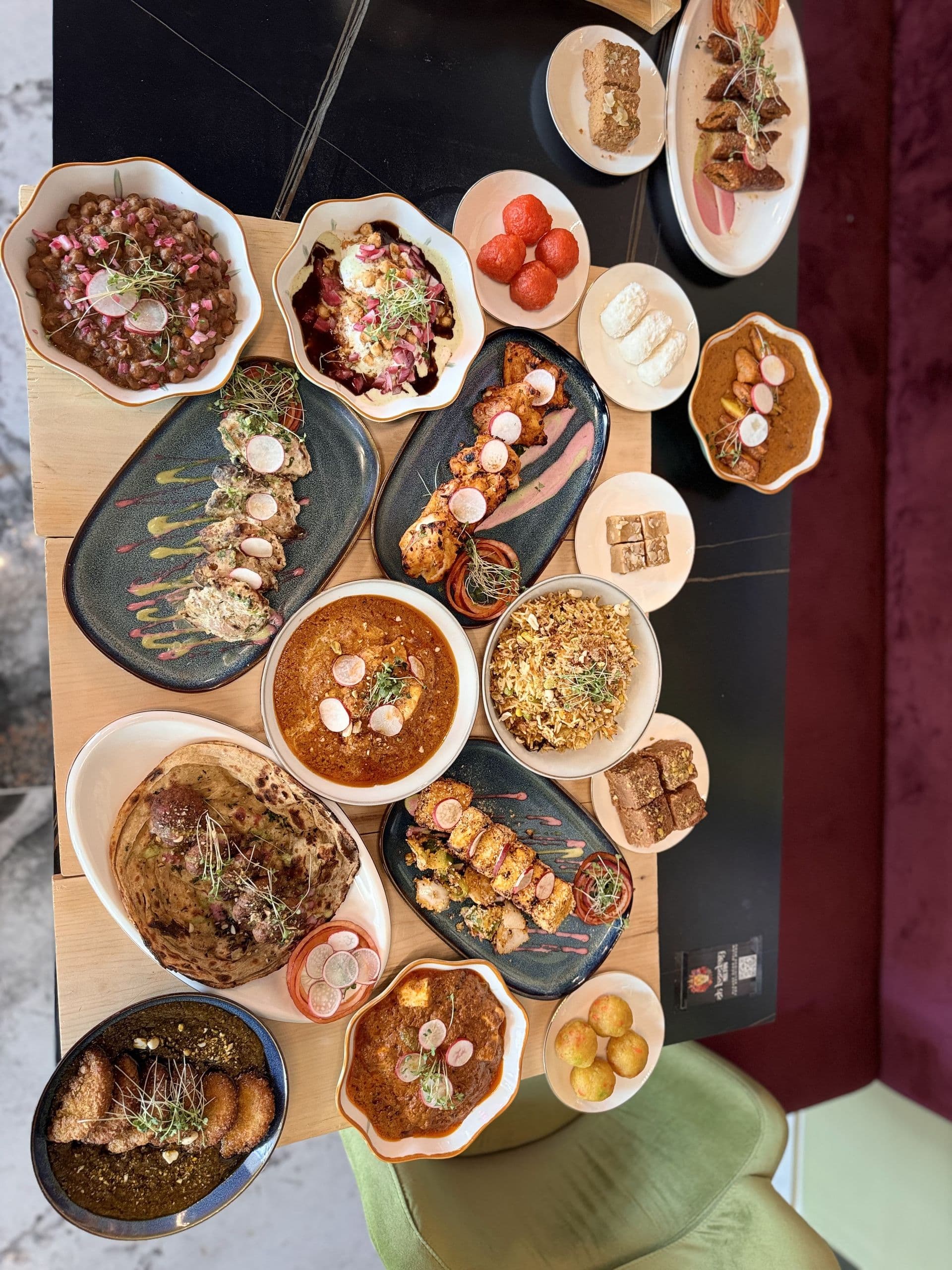 Overhead feast spread at DesINorth Milton — halal Indian & Hakka restaurant in Milton, Ontario, Canada