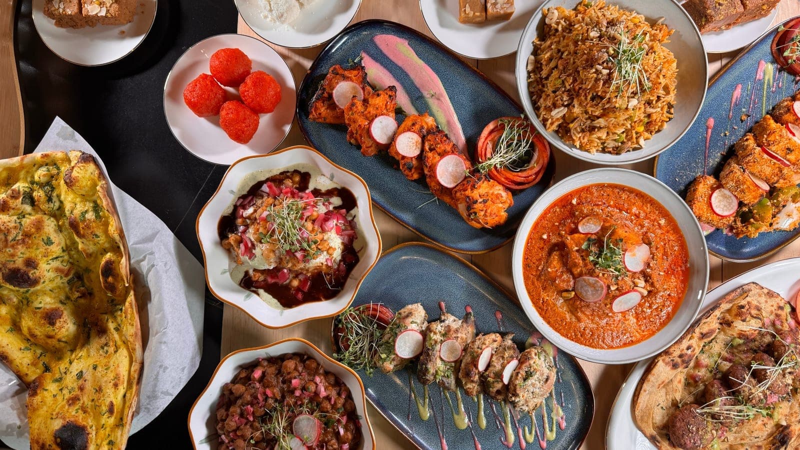 Overhead feast spread at DesINorth Milton — halal Indian & Hakka restaurant in Milton, Ontario