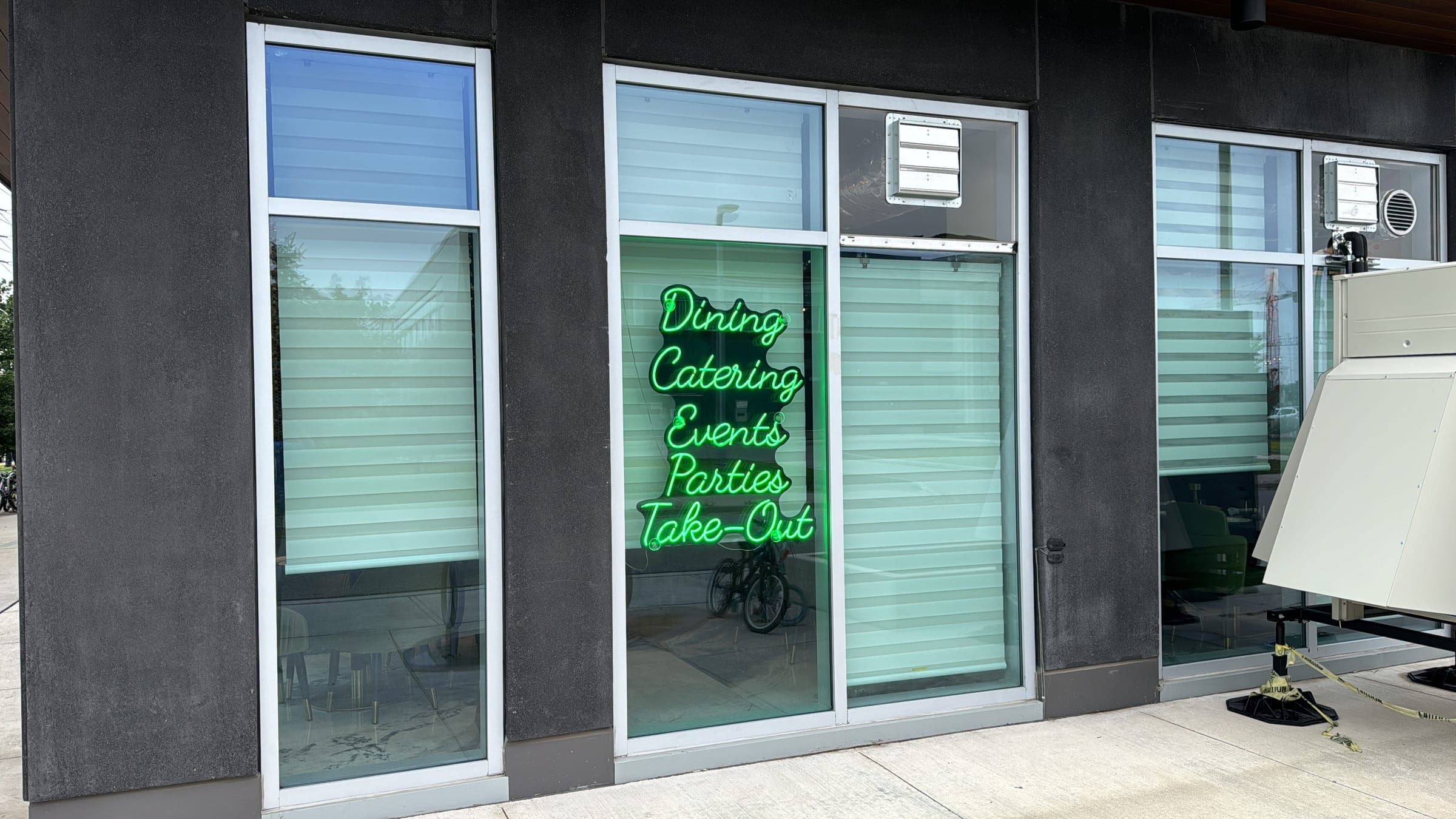 DesINorth Milton storefront with green neon, Milton, Ontario, Canada